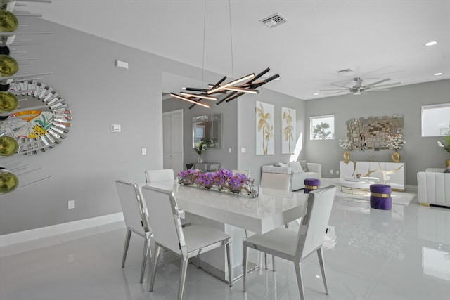 tiled dining area with ceiling fan