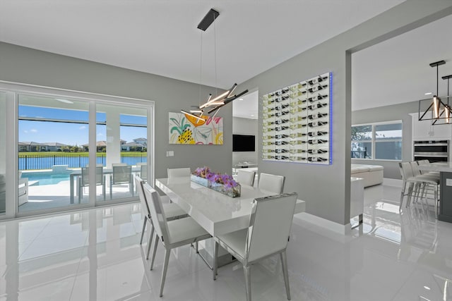 tiled dining area featuring a wealth of natural light