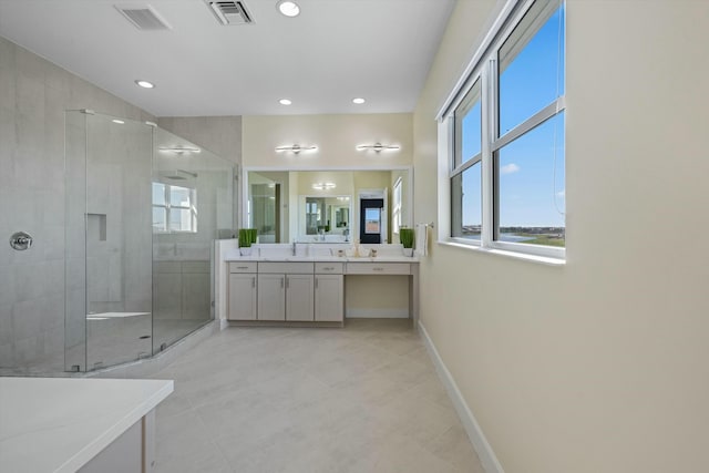 bathroom featuring walk in shower and vanity