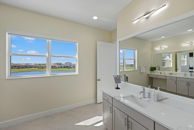 bathroom featuring vanity and a water view