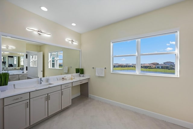 bathroom featuring tile patterned flooring and vanity