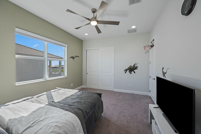 bedroom with ceiling fan, a closet, and carpet