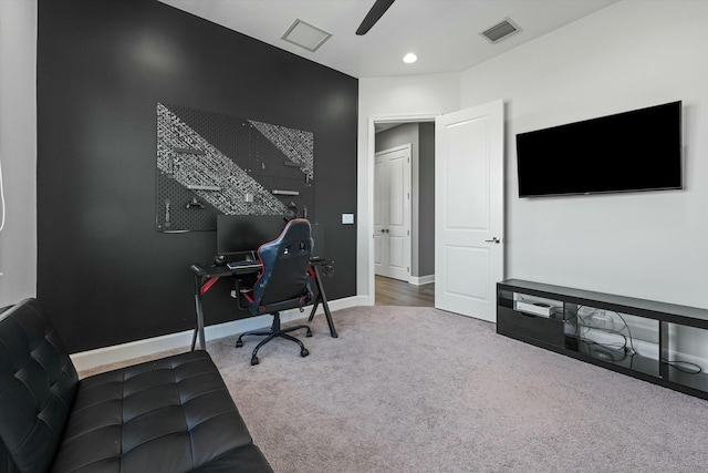 office space with carpet floors and ceiling fan