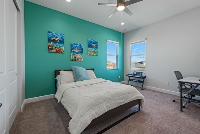 bedroom with ceiling fan, carpet flooring, and a closet