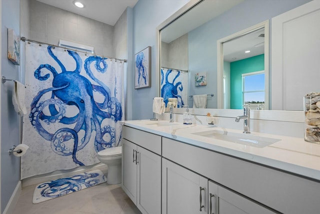 bathroom with vanity, tile patterned floors, and toilet