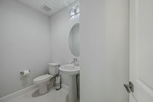 bathroom featuring tile patterned floors and toilet