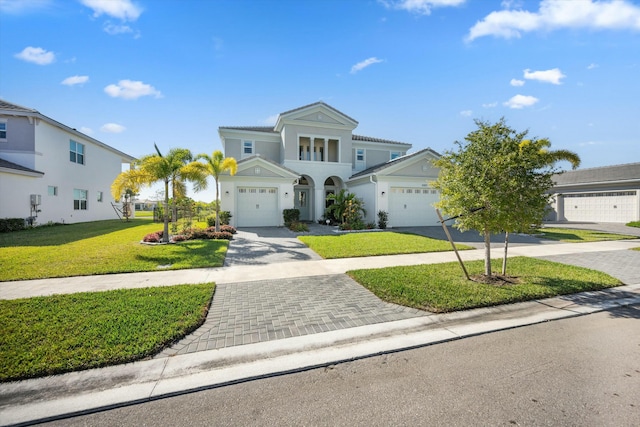 view of front of home with a garage and a front yard