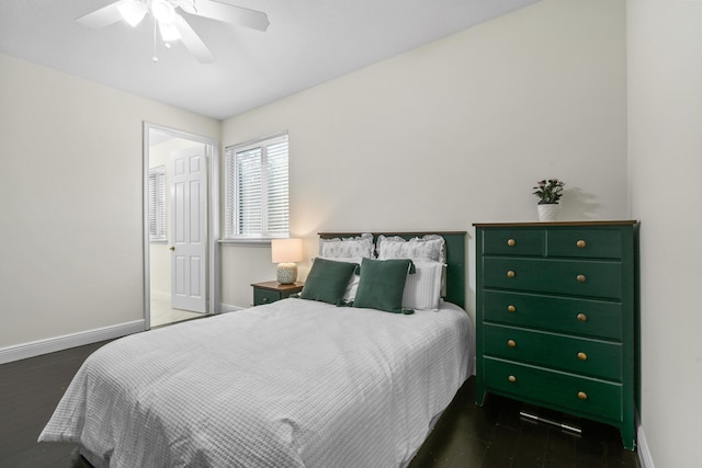 bedroom featuring ceiling fan and dark hardwood / wood-style floors