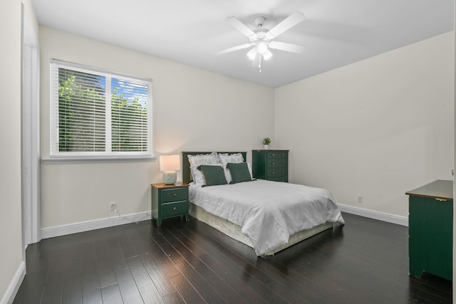 bedroom featuring ceiling fan and dark hardwood / wood-style floors