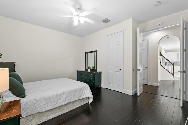 bedroom featuring dark hardwood / wood-style floors and ceiling fan