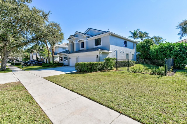 view of front of property with a garage and a front yard