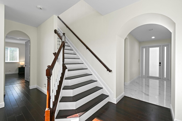 foyer entrance featuring dark hardwood / wood-style floors