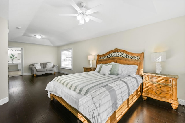 bedroom with dark hardwood / wood-style floors and ceiling fan