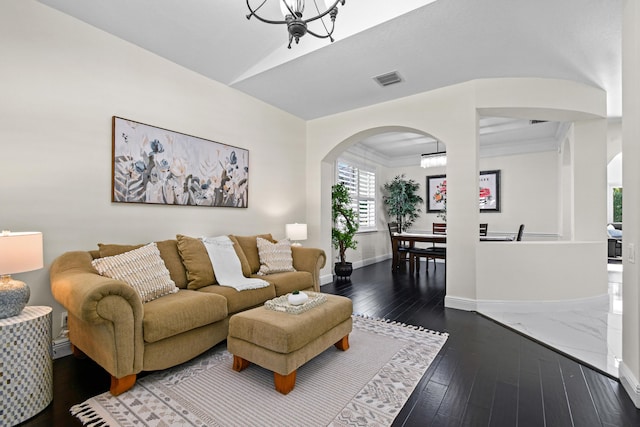 living room with a notable chandelier and wood-type flooring