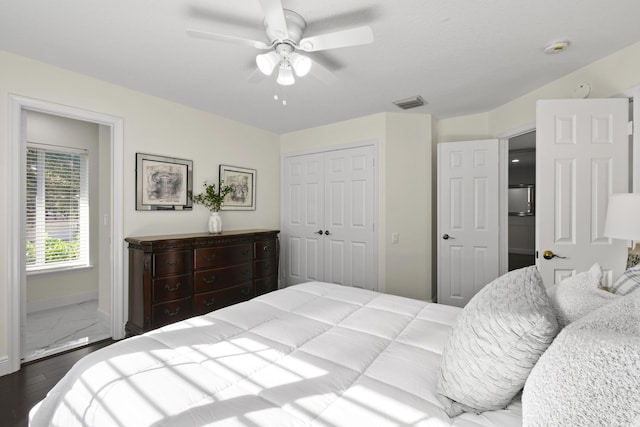 bedroom featuring ceiling fan, a closet, and hardwood / wood-style flooring