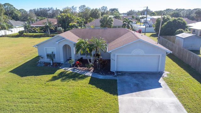 single story home with a garage and a front yard