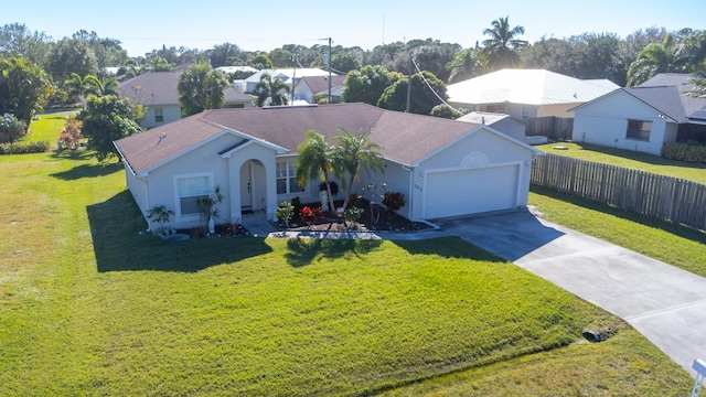 view of front facade featuring a garage and a front lawn