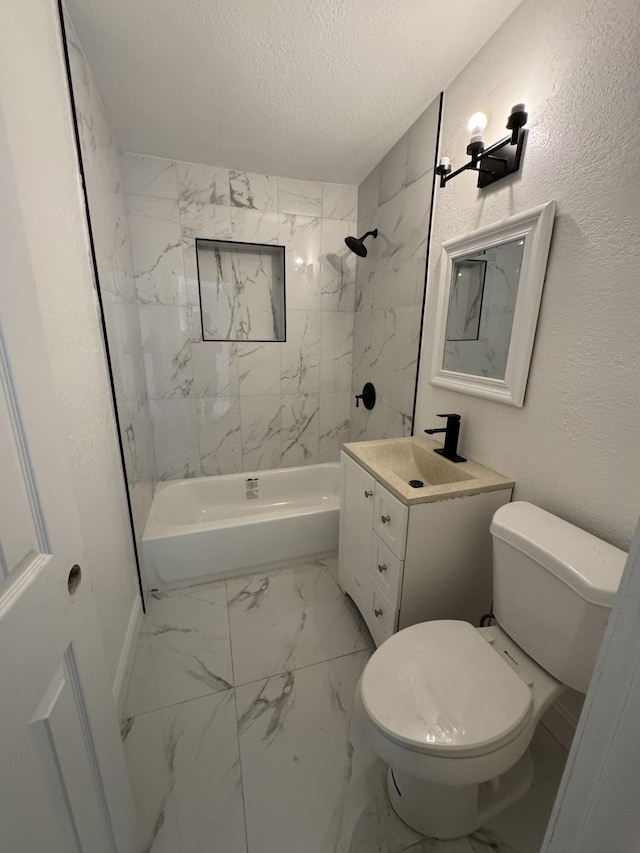 bathroom featuring a textured ceiling, marble finish floor, vanity, and bathing tub / shower combination