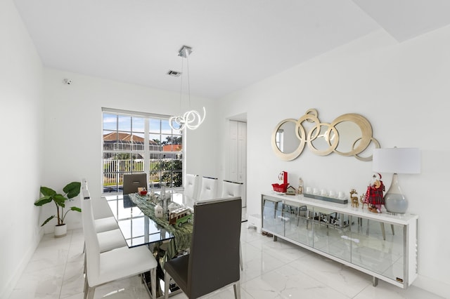 dining area featuring a chandelier