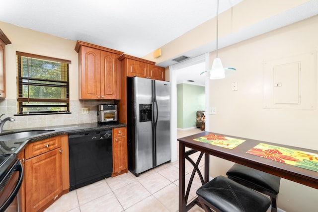 kitchen featuring backsplash, stainless steel appliances, sink, decorative light fixtures, and light tile patterned flooring