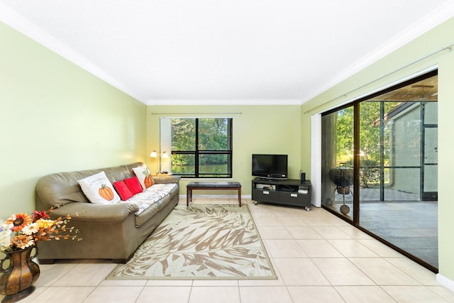 living room featuring a healthy amount of sunlight, light tile patterned flooring, and crown molding