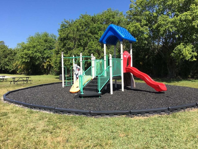 view of jungle gym with a lawn