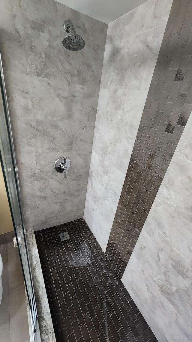 full bath with a shower stall