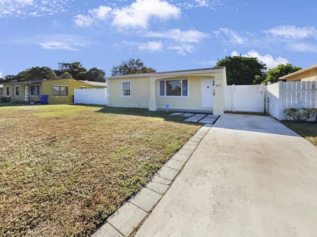 ranch-style house with a front lawn