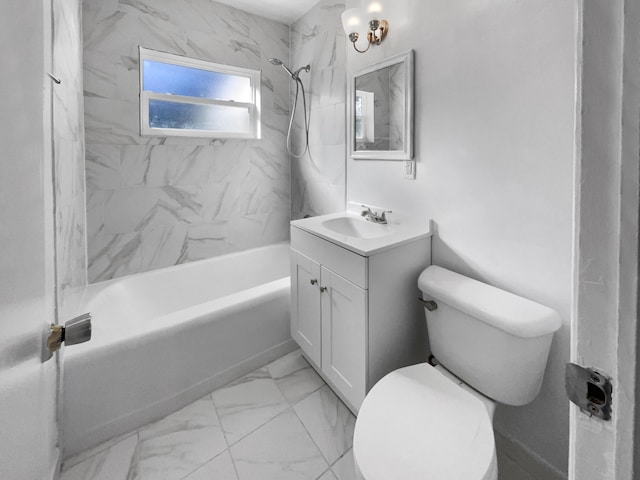 full bathroom with toilet, vanity, and tiled shower / bath