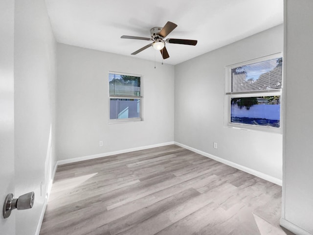 unfurnished room with ceiling fan and light hardwood / wood-style flooring