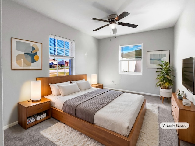 carpeted bedroom featuring ceiling fan