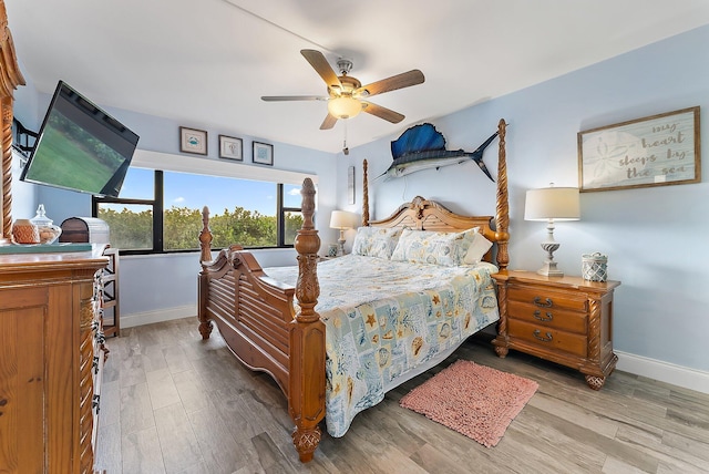 bedroom featuring ceiling fan and light hardwood / wood-style flooring