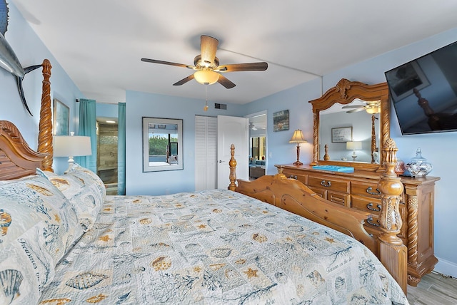 bedroom with ceiling fan, a closet, ensuite bathroom, and light wood-type flooring