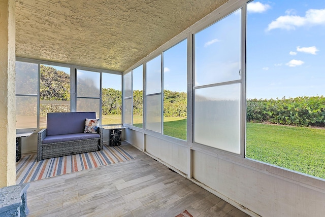 sunroom / solarium featuring a healthy amount of sunlight