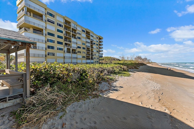 7370 S Ocean Dr Unit 111, Jensen Beach, FL 34957 - view of apartment building / complex featuring view of water and beach