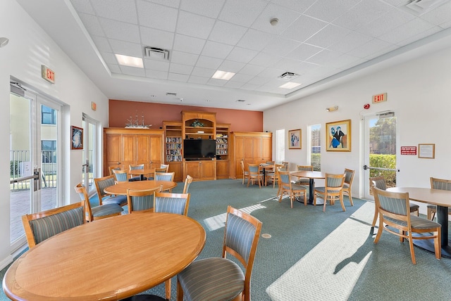 7370 S Ocean Dr Unit 111, Jensen Beach, FL 34957 - carpeted dining room featuring a paneled ceiling
