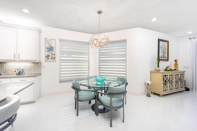 dining space with a notable chandelier