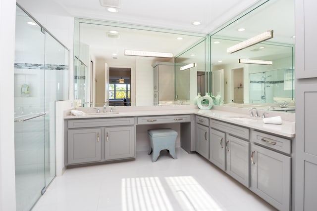 bathroom featuring walk in shower, vanity, and tile patterned flooring