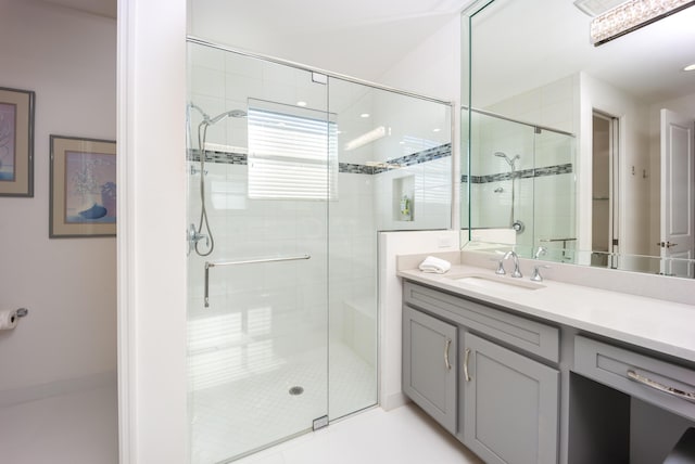bathroom with vanity and an enclosed shower