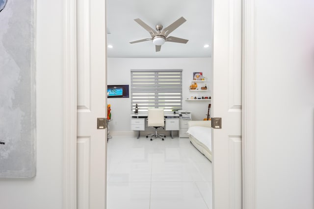 home office with light tile patterned flooring and ceiling fan