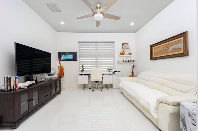 tiled home office featuring ceiling fan