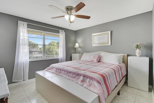 bedroom featuring light tile patterned floors and ceiling fan