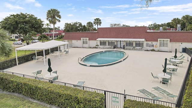 view of swimming pool with a patio area