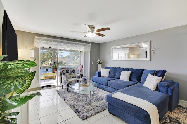 tiled living room with ceiling fan