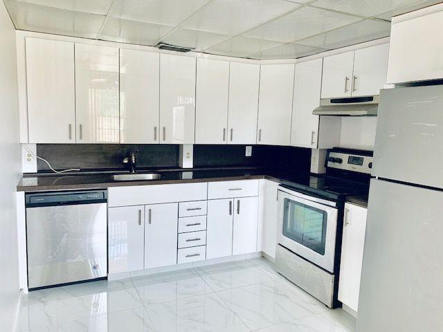 kitchen featuring a drop ceiling, white cabinets, sink, tasteful backsplash, and stainless steel appliances