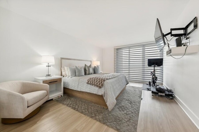 bedroom with wood-type flooring