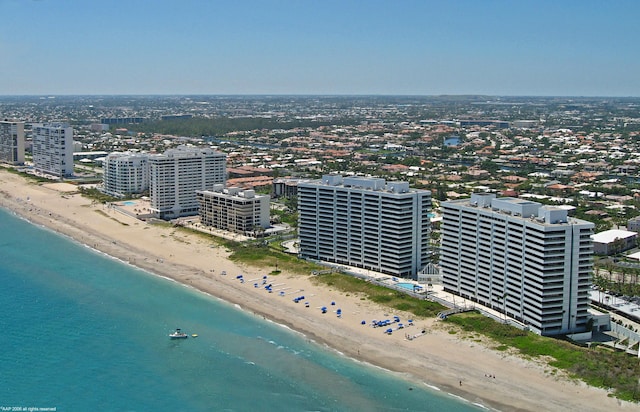 aerial view featuring a view of the beach and a water view