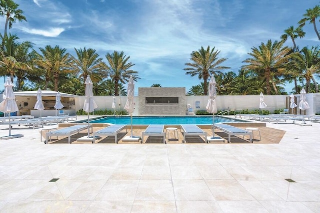 view of swimming pool with a patio