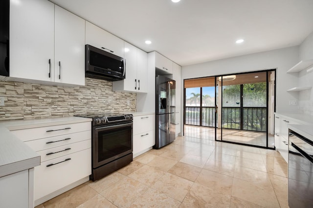 kitchen with backsplash, white cabinets, and black appliances