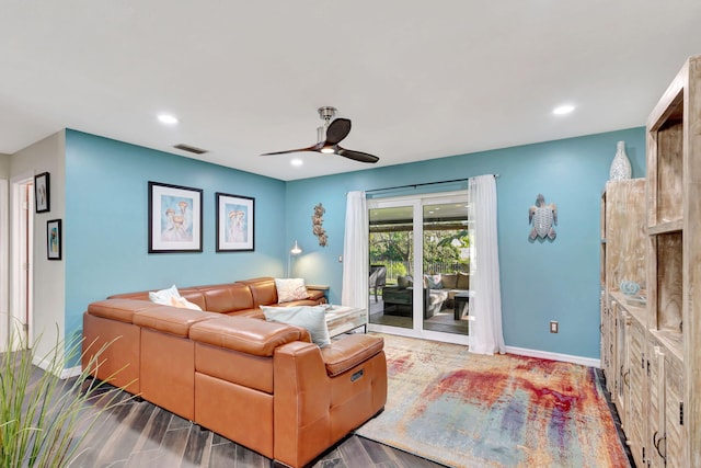 living room with hardwood / wood-style flooring and ceiling fan